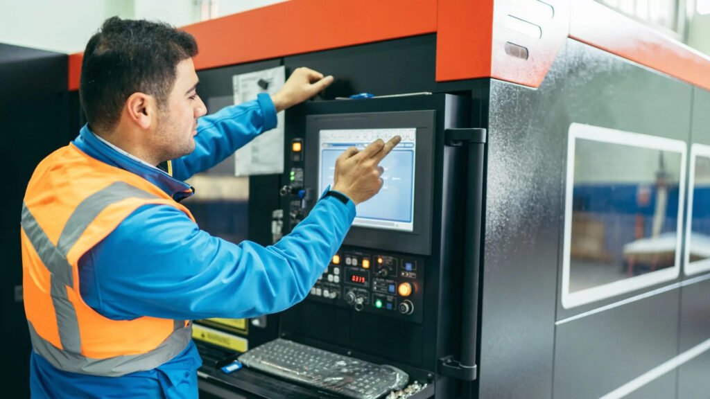 Workers operating CNC lathes